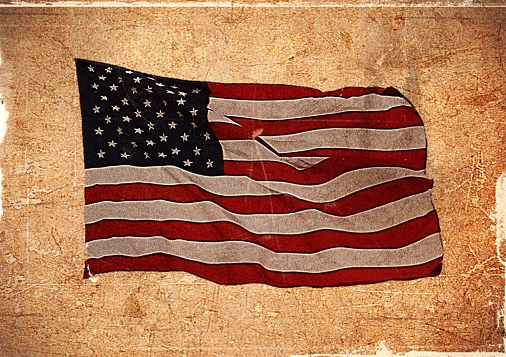 how to dispose of old US flag, damaged american flag disposal, worn US flag etiquette